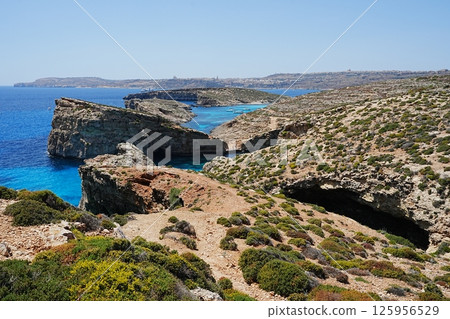 Scenic landscape with crystal lagoon in European Comino island in Malta Scenic landscape with crystal lagoon in European Comino island in Malta 125956529