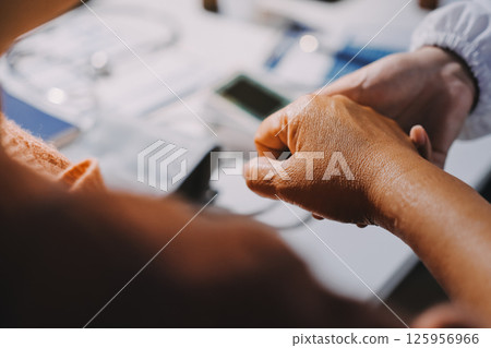 Orthopedist examining patient in hospital Orthopedist examining patient in hospital 125956966