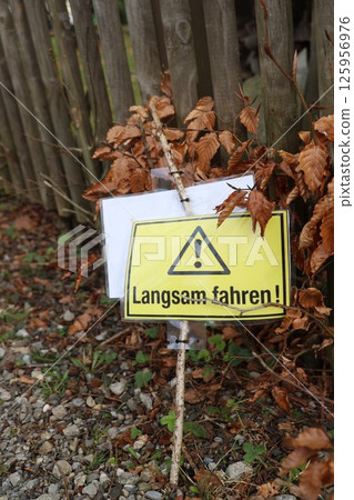 A sign with a yellow background A sign with a yellow background 125956976