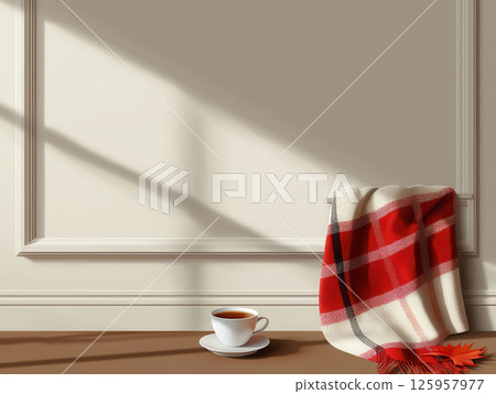 Cozy corner with soft blanket, cup of herbal tea, and gentle sunlight creating warm atmosphere 125957977