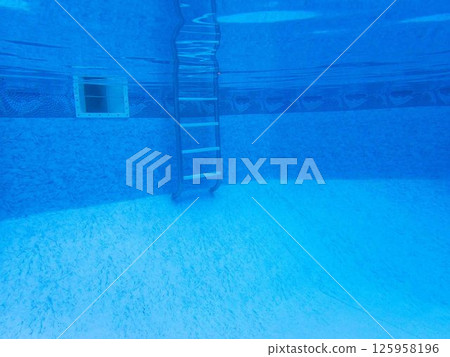 underwater view of swimming pool ladder clean blue liner and skimmer underwater view of swimming pool ladder clean blue liner and skimmer 125958196