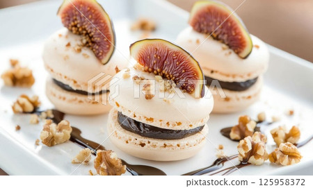 Delightful French Macaroons with Fig Topping and Chocolate Filling Served on a White Plate Surrounded by Nuts and Drizzled Sauce for a Gourmet Dessert Experience Delightful French Macaroons with Fig Topping and Chocolate Filling Served on a White Plate Surrounded by Nuts and Drizzled Sauce for a Gourmet Dessert Experience 125958372