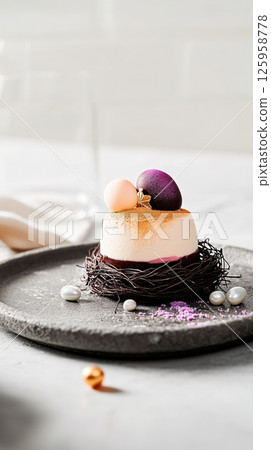 Delicate pastel-hued dessert featuring airy mousse in a velvety glaze with Easter decor Delicate pastel-hued dessert featuring airy mousse in a velvety glaze with Easter decor 125958778