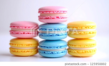 Beautiful Stack of Colorful Macarons on White Background 125958802