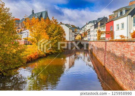 Saarburg, Germany. Old town and Saar River reflection, autumn colors. Saarburg, Germany. Old town and Saar River reflection, autumn colors. 125958990
