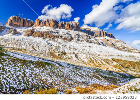 Sass Pordoi, Italy. Dolomites Mountains scenic plateau at 2,950 meters, offering panoramic views over Sella Group and Val Gardena, Trentino-Alto Adige travel destination. Sass Pordoi, Italy. Dolomites Mountains scenic plateau at 2,950 meters, offering panoramic views over Sella Group and Val Gardena, Trentino-Alto Adige travel destination. 125959028