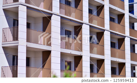 Modern new residential apartment house building complex. Exterior view of modern apartment building. New construction apartment or condo complex. 125959413