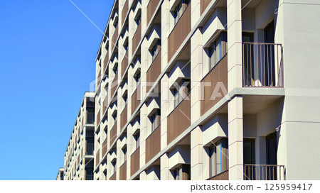 Modern new residential apartment house building complex. Exterior view of modern apartment building. New construction apartment or condo complex. 125959417