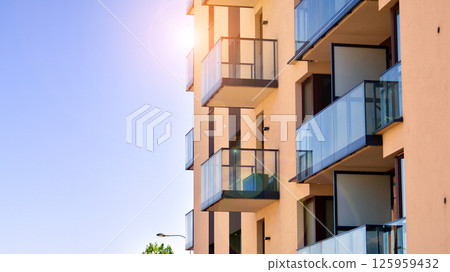 Modern new residential apartment house building complex. Exterior view of modern apartment building. New construction apartment or condo complex. 125959432