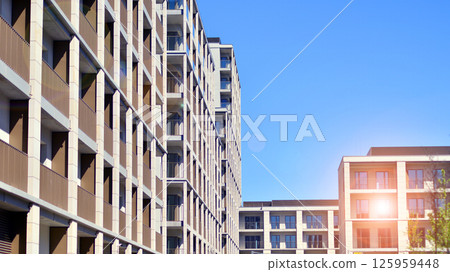 Modern new residential apartment house building complex. Exterior view of modern apartment building. New construction apartment or condo complex. Modern new residential apartment house building complex. Exterior view of modern apartment building. New construction apartment or condo complex. 125959448
