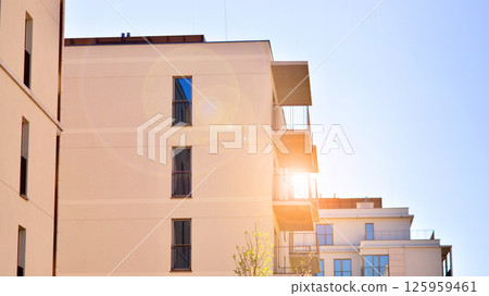 Modern new residential apartment house building complex. Exterior view of modern apartment building. New construction apartment or condo complex. 125959461