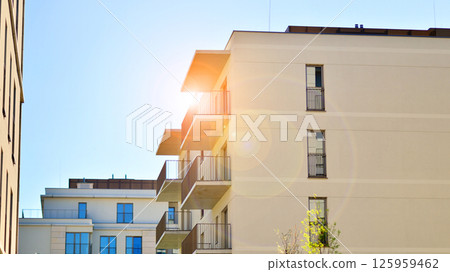 Modern new residential apartment house building complex. Exterior view of modern apartment building. New construction apartment or condo complex. 125959462