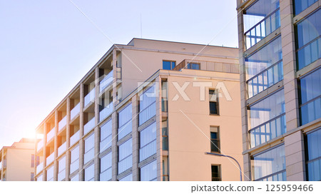 Modern new residential apartment house building complex. Exterior view of modern apartment building. New construction apartment or condo complex. Modern new residential apartment house building complex. Exterior view of modern apartment building. New construction apartment or condo complex. 125959466