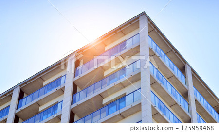 Modern new residential apartment house building complex. Exterior view of modern apartment building. New construction apartment or condo complex. Modern new residential apartment house building complex. Exterior view of modern apartment building. New construction apartment or condo complex. 125959468