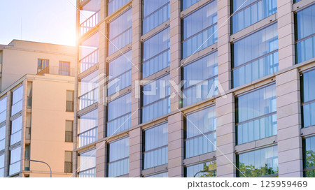 Modern new residential apartment house building complex. Exterior view of modern apartment building. New construction apartment or condo complex. Modern new residential apartment house building complex. Exterior view of modern apartment building. New construction apartment or condo complex. 125959469