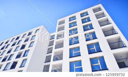 Modern new residential apartment house building complex. Exterior view of modern apartment building. New construction apartment or condo complex. Modern new residential apartment house building complex. Exterior view of modern apartment building. New construction apartment or condo complex. 125959732