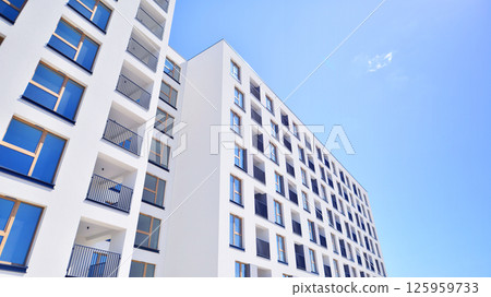 Modern new residential apartment house building complex. Exterior view of modern apartment building. New construction apartment or condo complex. Modern new residential apartment house building complex. Exterior view of modern apartment building. New construction apartment or condo complex. 125959733