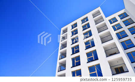 Modern new residential apartment house building complex. Exterior view of modern apartment building. New construction apartment or condo complex. 125959735