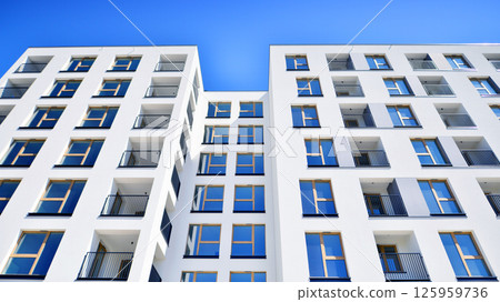 Modern new residential apartment house building complex. Exterior view of modern apartment building. New construction apartment or condo complex. 125959736