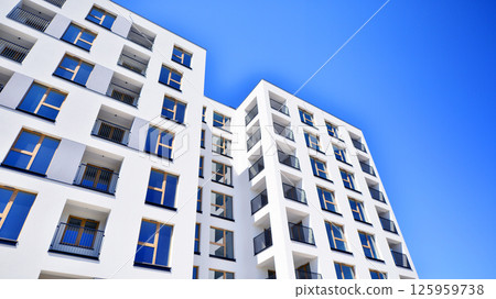 Modern new residential apartment house building complex. Exterior view of modern apartment building. New construction apartment or condo complex. 125959738
