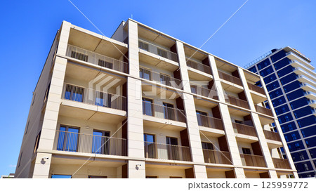 Modern new residential apartment house building complex. Exterior view of modern apartment building. New construction apartment or condo complex. Modern new residential apartment house building complex. Exterior view of modern apartment building. New construction apartment or condo complex. 125959772