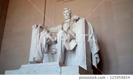 Imposing marble statue of Abraham Lincoln sitting inside the Lincoln Memorial in Washington DC Imposing marble statue of Abraham Lincoln sitting inside the Lincoln Memorial in Washington DC 125959854