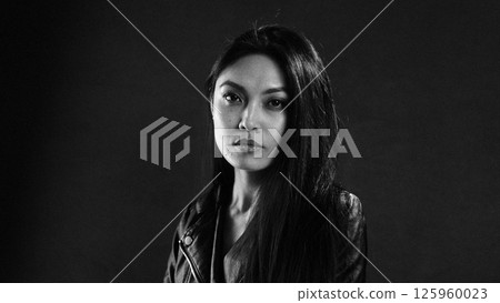 Contemplative Woman in Dramatic Lighting Portrait Contemplative Woman in Dramatic Lighting Portrait 125960023