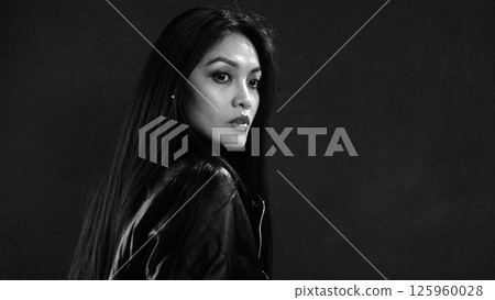 Confident Woman in Dramatic Black and White Portrait Confident Woman in Dramatic Black and White Portrait 125960028