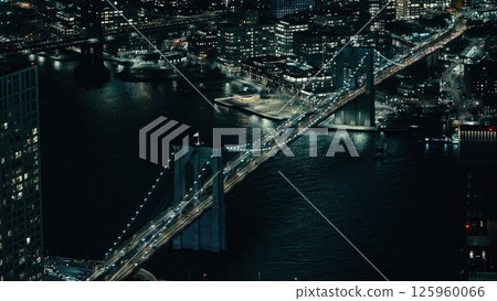 Brooklyn Bridge connecting Manhattan and Brooklyn at night, New York City Brooklyn Bridge connecting Manhattan and Brooklyn at night, New York City 125960066