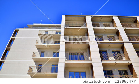 Modern new residential apartment house building complex. Exterior view of modern apartment building. New construction apartment or condo complex. 125960477