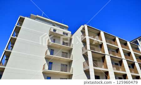 Modern new residential apartment house building complex. Exterior view of modern apartment building. New construction apartment or condo complex. 125960479