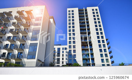 Modern new residential apartment house building complex. Exterior view of modern apartment building. New construction apartment or condo complex. 125960674