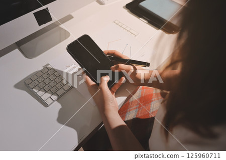 Expert woman asian female people review data number costing managerial account prepare monthly actual cost variance report at tax audit office. ESG sheet budget control ERP process service project. 125960711