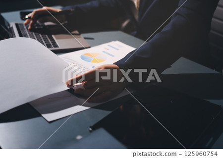 Expert woman asian female people review data number costing managerial account prepare monthly actual cost variance report at tax audit office. ESG sheet budget control ERP process service project. 125960754