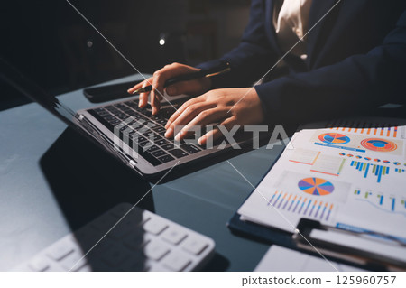 Expert woman asian female people review data number costing managerial account prepare monthly actual cost variance report at tax audit office. ESG sheet budget control ERP process service project. 125960757