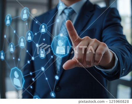 Businessman interacting with virtual human resource network and digital employee icons 125960828
