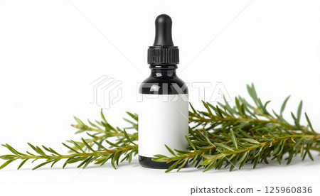 Rosemary essential oil dropper bottles with fresh rosemary herbs on white background Rosemary essential oil dropper bottles with fresh rosemary herbs on white background 125960836