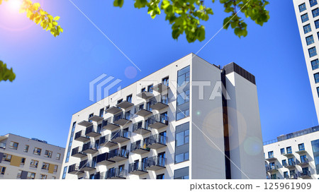 Eco apartment building saving energy and fresh air. Modern block of flats in green area, residential apartment and luxury house complex.  125961909