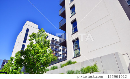 Eco apartment building saving energy and fresh air. Modern block of flats in green area, residential apartment and luxury house complex. Eco apartment building saving energy and fresh air. Modern block of flats in green area, residential apartment and luxury house complex. 125961912