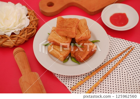 a plate of Indonesian fried tofu 125962560