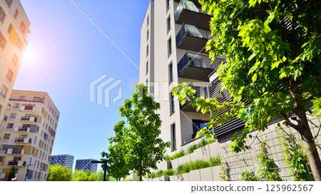Eco apartment building saving energy and fresh air. Modern block of flats in green area, residential apartment and luxury house complex.  Eco apartment building saving energy and fresh air. Modern block of flats in green area, residential apartment and luxury house complex.  125962567