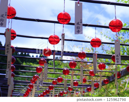 Wind chimes hanging in the shrine's premises Wind chimes hanging in the shrine's premises 125962798