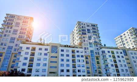 Modern new residential apartment house building complex. Exterior view of modern apartment building. New construction apartment or condo complex. 125962980