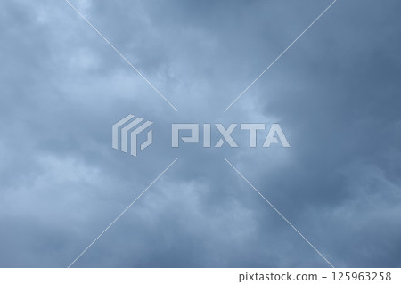 dark rain cloud floating on sky at sunset in evening 125963258