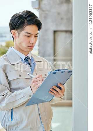 A young man in his 20s checking 125963337