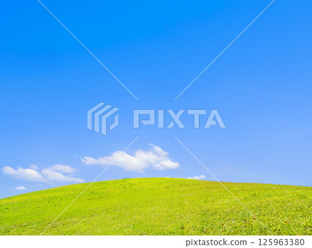 Spring blue sky and fresh green hills Spring blue sky and fresh green hills 125963380