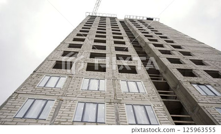 Urban residential construction project showing building facade Urban residential construction project showing building facade 125963555