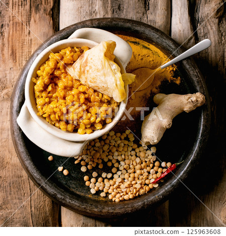 Traditional indian yellow pea food dal with roti bread Traditional indian yellow pea food dal with roti bread 125963608
