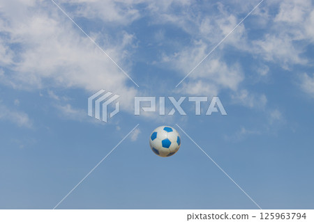 Blue sky and soccer ball 125963794