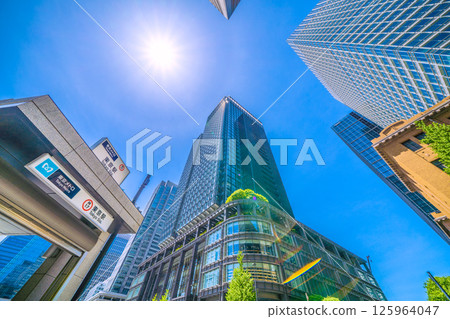 Tokyo cityscape in Japan. View of Tokyo Station (exit M10) on the Tokyo Metro Marunouchi Line, Haro, and the Marunouchi buildings. 125964047